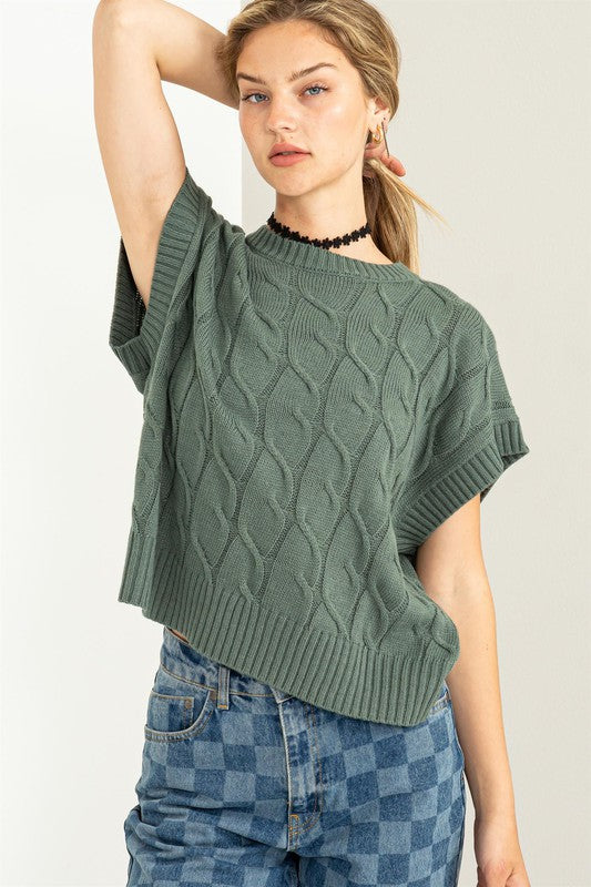 SLEEVELESS OVERSIZED CABLE KNIT SWEATER
