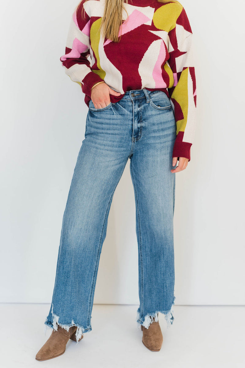 ASYMMETRICAL HEM JEANS