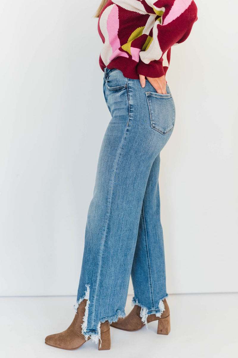 ASYMMETRICAL HEM JEANS