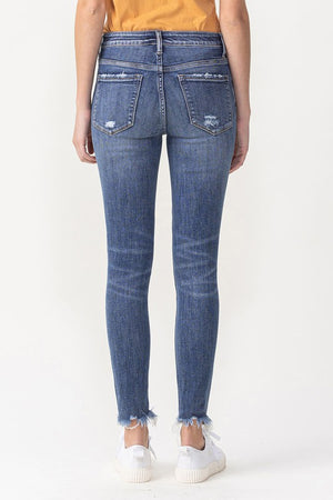 MID RISE ANKLE SKINNY WITH FRAYED HEM DETAIL