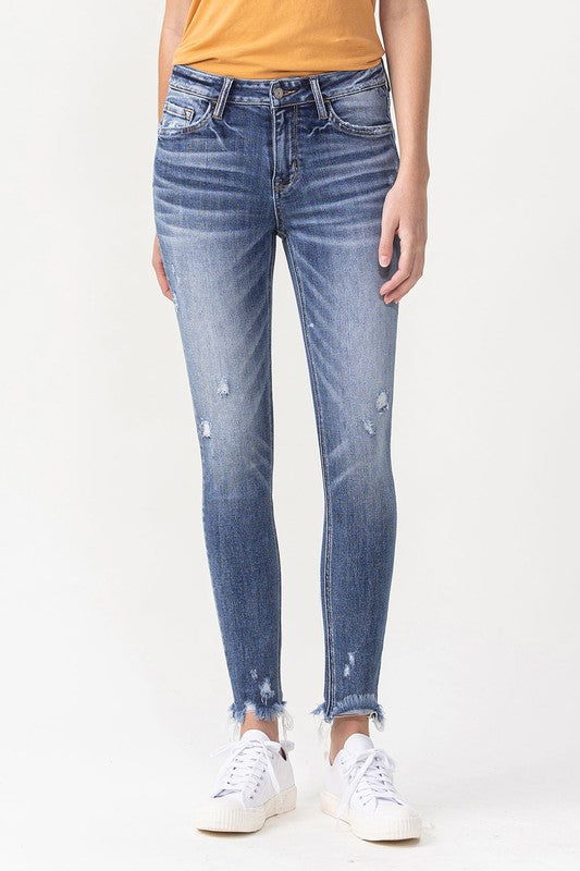 MID RISE ANKLE SKINNY WITH FRAYED HEM DETAIL